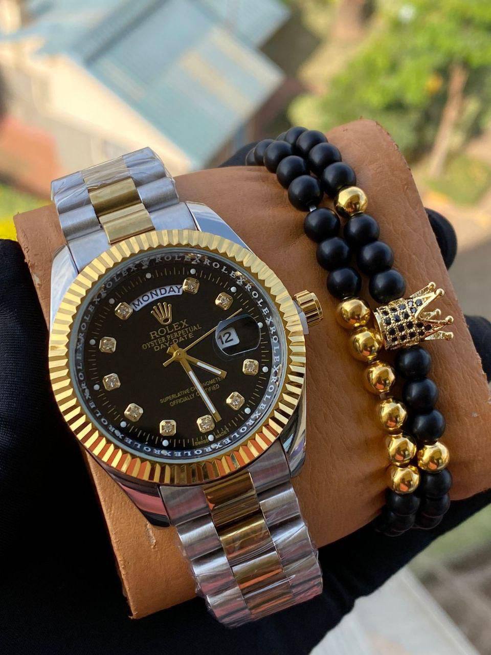 ROLEX X BANGLE DAY AND DATE DISPLAY BATTERY POWERED WATER RESISTANT STAINLESS STEEL ENQUIRIES