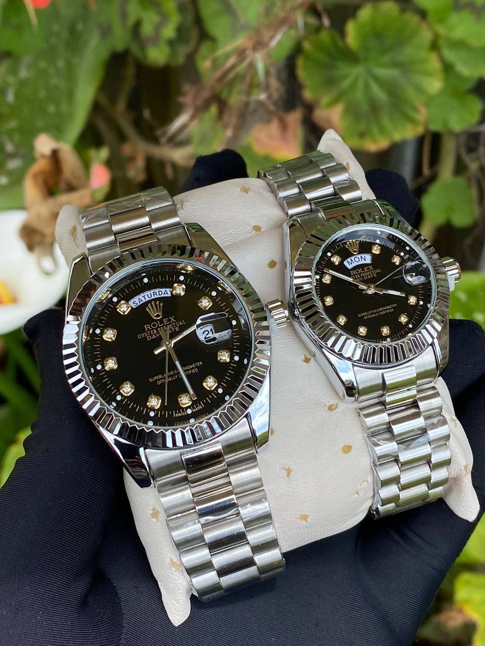 ROLEX COUPLE WATCHES SINGLE PIECE DAY AND DATE DISPLAY WATER RESISTANT BATTERY POWERED ENQUIRIES