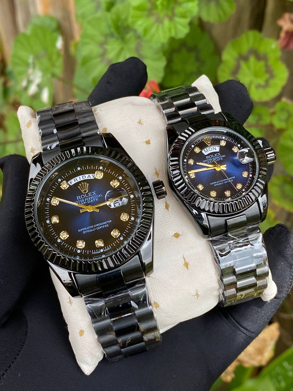 ROLEX COUPLE WATCHES SINGLE PIECE DAY AND DATE DISPLAY WATER RESISTANT BATTERY POWERED ENQUIRIES