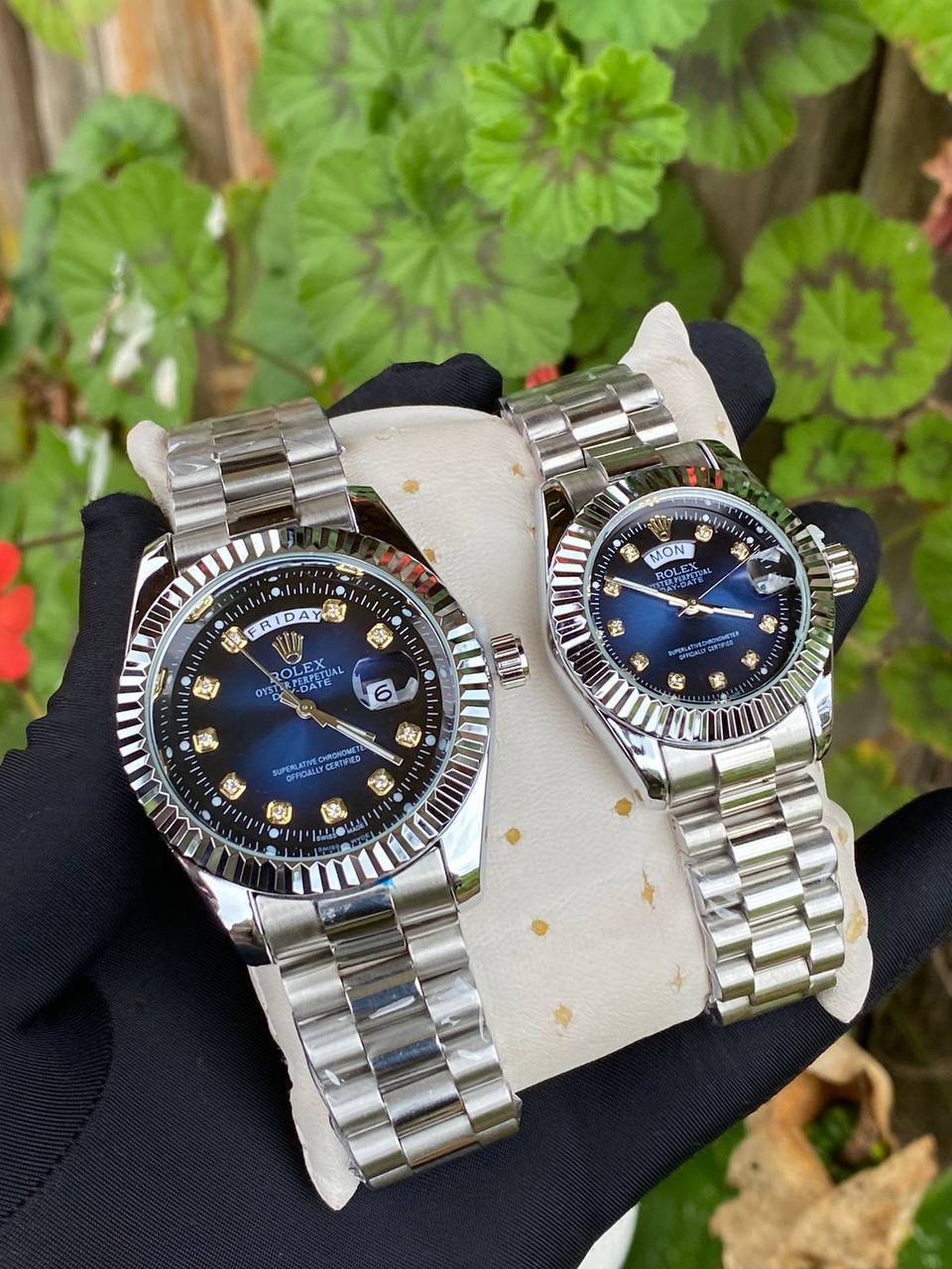 ROLEX COUPLE WATCHES SINGLE PIECE DAY AND DATE DISPLAY WATER RESISTANT BATTERY POWERED ENQUIRIES