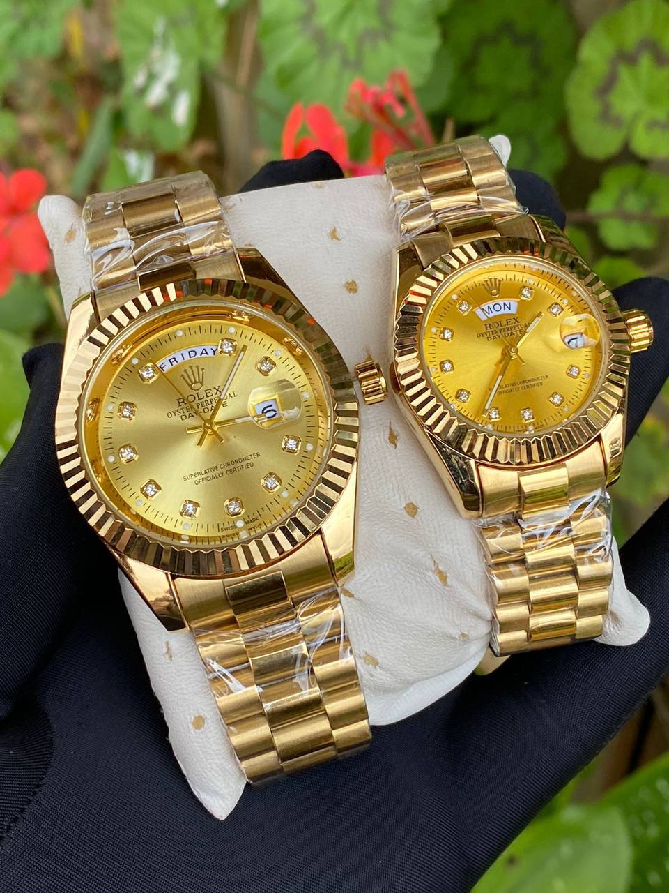 ROLEX COUPLE WATCHES SINGLE PIECE DAY AND DATE DISPLAY WATER RESISTANT BATTERY POWERED ENQUIRIES