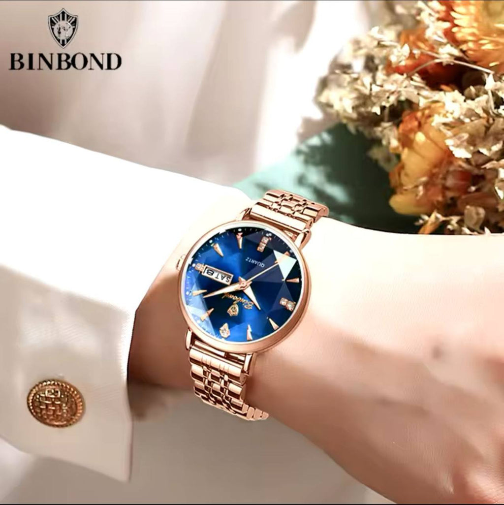 BINBOND LADIES WATER RESISTANT BATTERY POWERED NON FADE STEEL POLISH DAY AND DATE DISPLAY AND ENQUIRIES