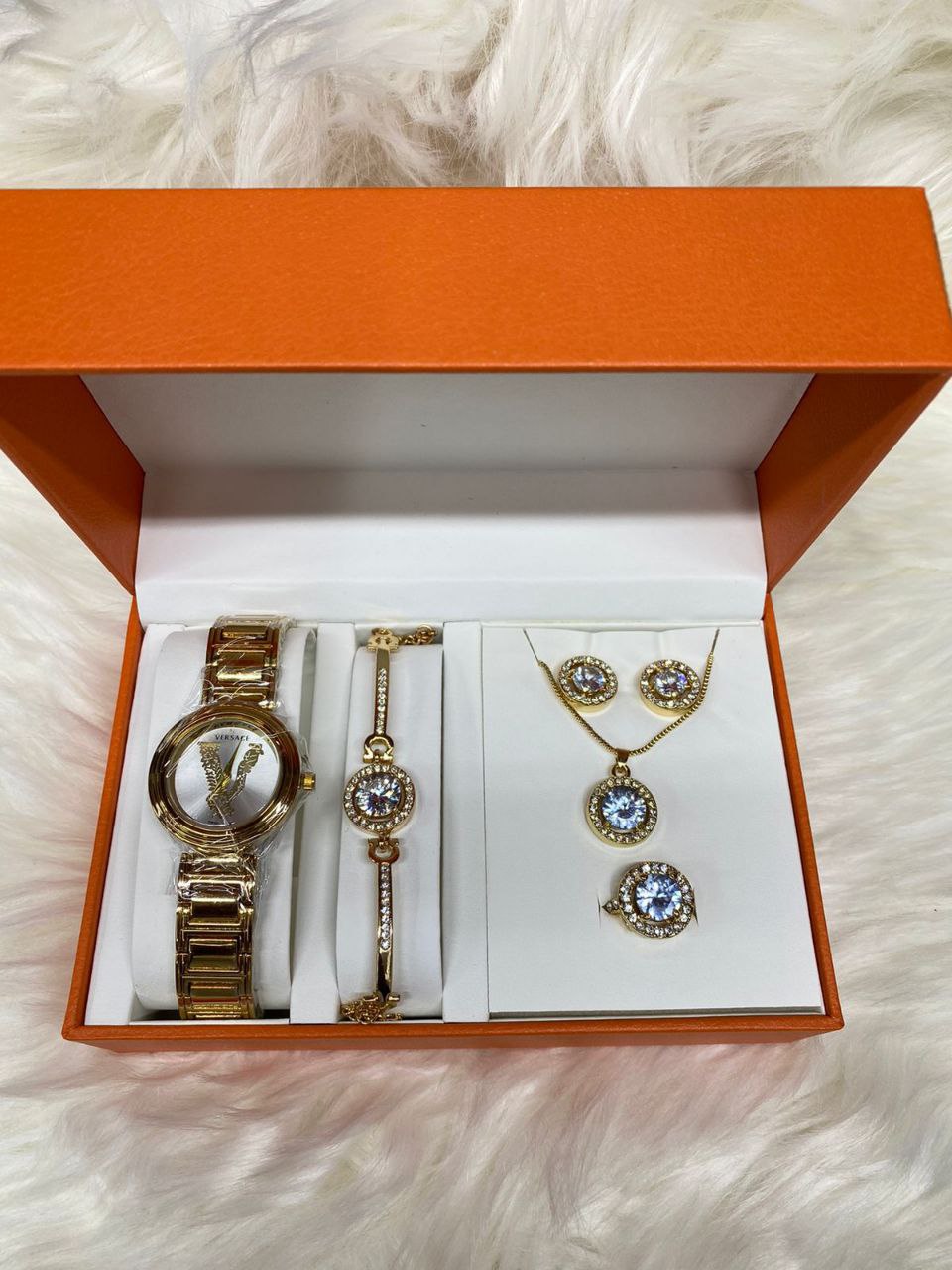 A SET OF WATCH BRACELET NECKLACE EARRINGS RING