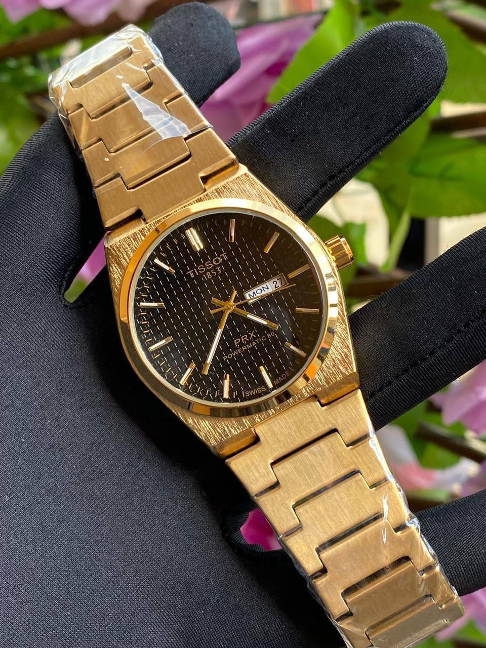 TISSOT DAY & DATE BATTERY POWERED WATER RESISTANT DAY & DATE DISPLAY STAINLESS STEEL FINISH ENGRAVING SERVICES ENQUIRIES