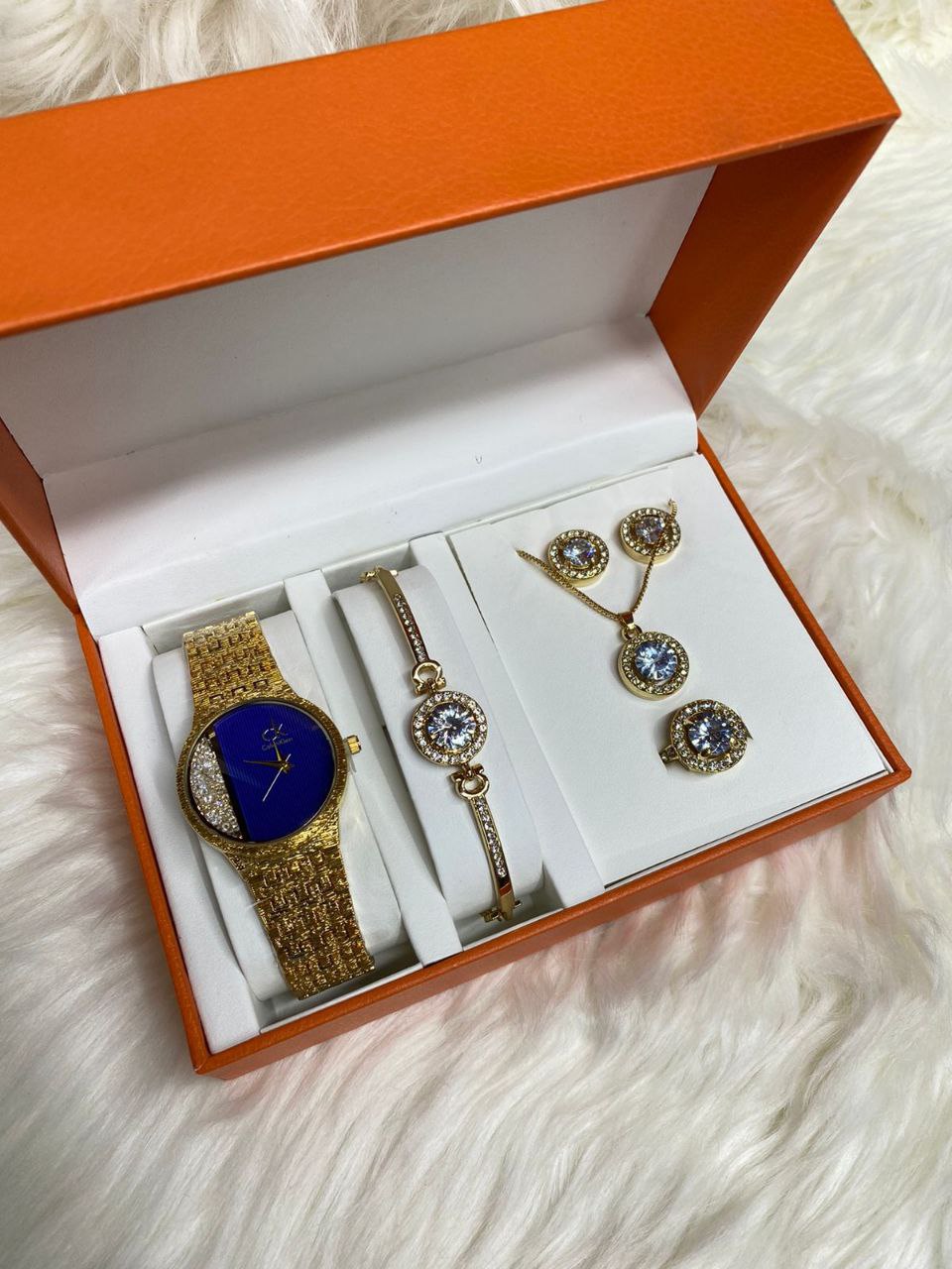 A SET OF WATCH BRACELET NECKLACE EARRINGS RING