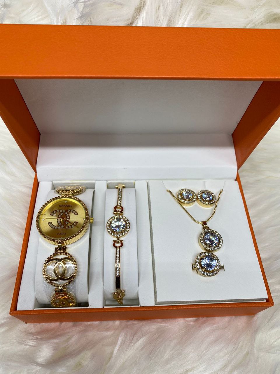 A SET OF WATCH BRACELET NECKLACE EARRINGS RING