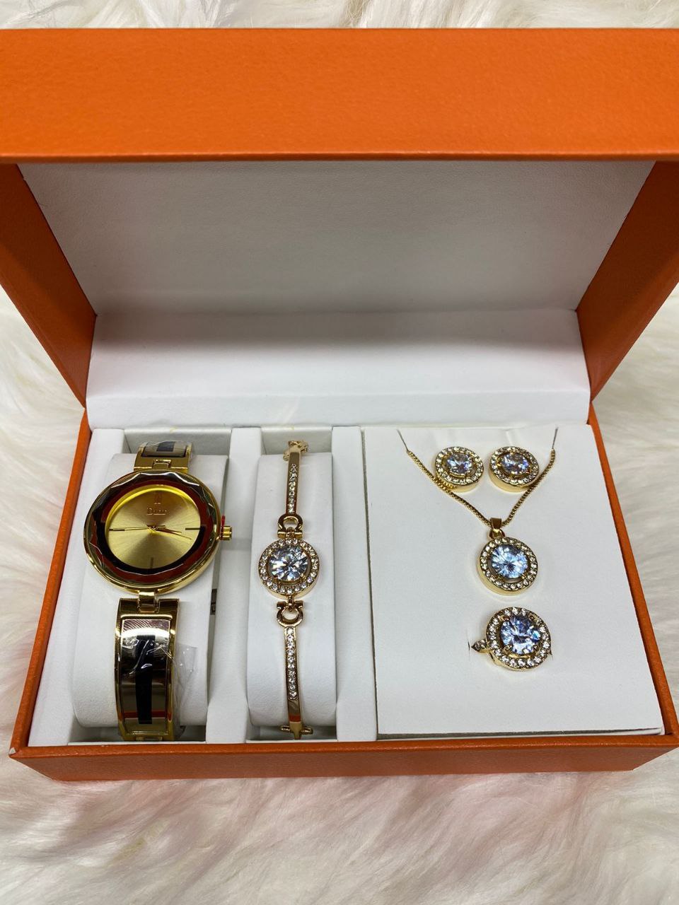 A SET OF WATCH BRACELET NECKLACE EARRINGS RING