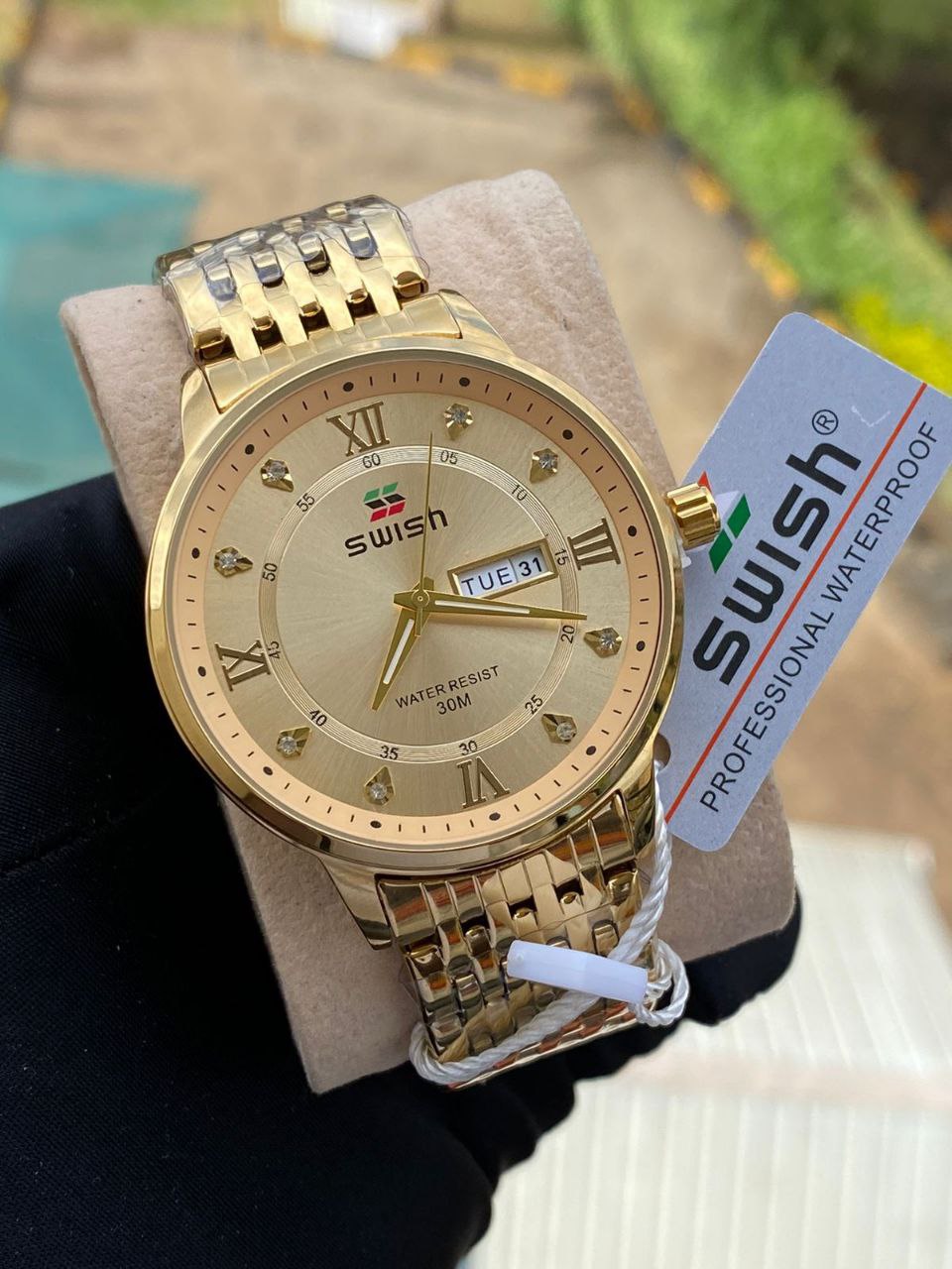 SWISH GENTS WATCH DAY&DATE DISPLAY BATTERY POWERED STAINLESS STEEL WATER RESISTANT TWO-TONE GOLDSILVER ENQUIRIES