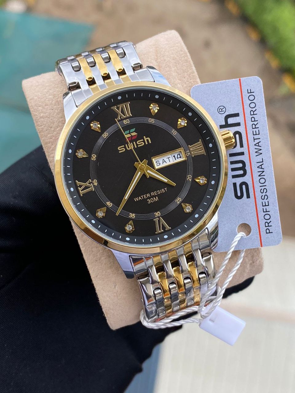 SWISH GENTS WATCH DAY&DATE DISPLAY BATTERY POWERED STAINLESS STEEL WATER RESISTANT TWO-TONE GOLDSILVER ENQUIRIES