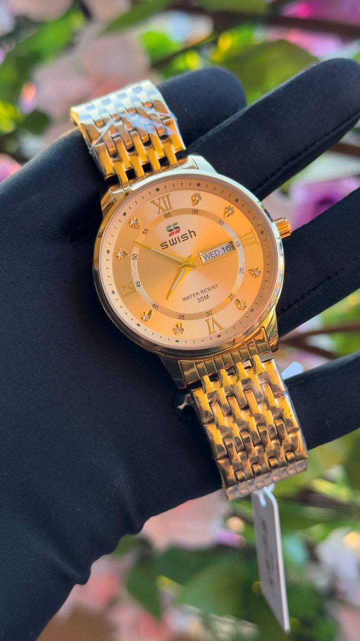 SWISH GENTS WATCH DAY&DATE DISPLAY BATTERY POWERED STAINLESS STEEL WATER RESISTANT TWO-TONE GOLDSILVER