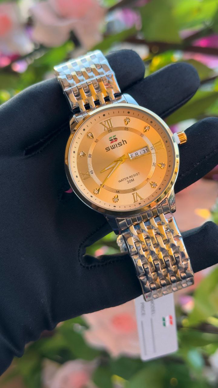 SWISH GENTS WATCH DAY&DATE DISPLAY BATTERY POWERED STAINLESS STEEL WATER RESISTANT TWO-TONE GOLDSILVER