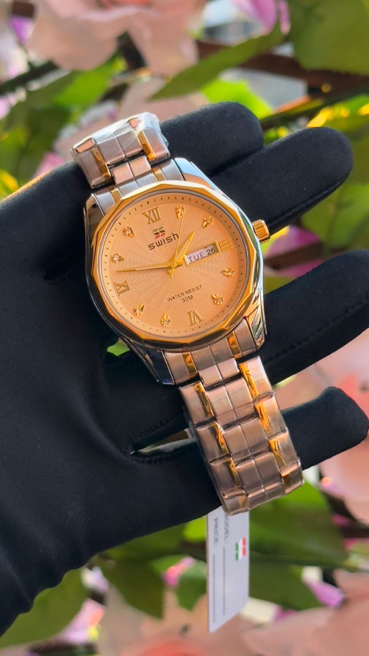 SWISH GENTS WATCH DAY&DATE DISPLAY BATTERY POWERED STAINLESS STEEL WATER RESISTANT TWO-TONE GOLDSILVER