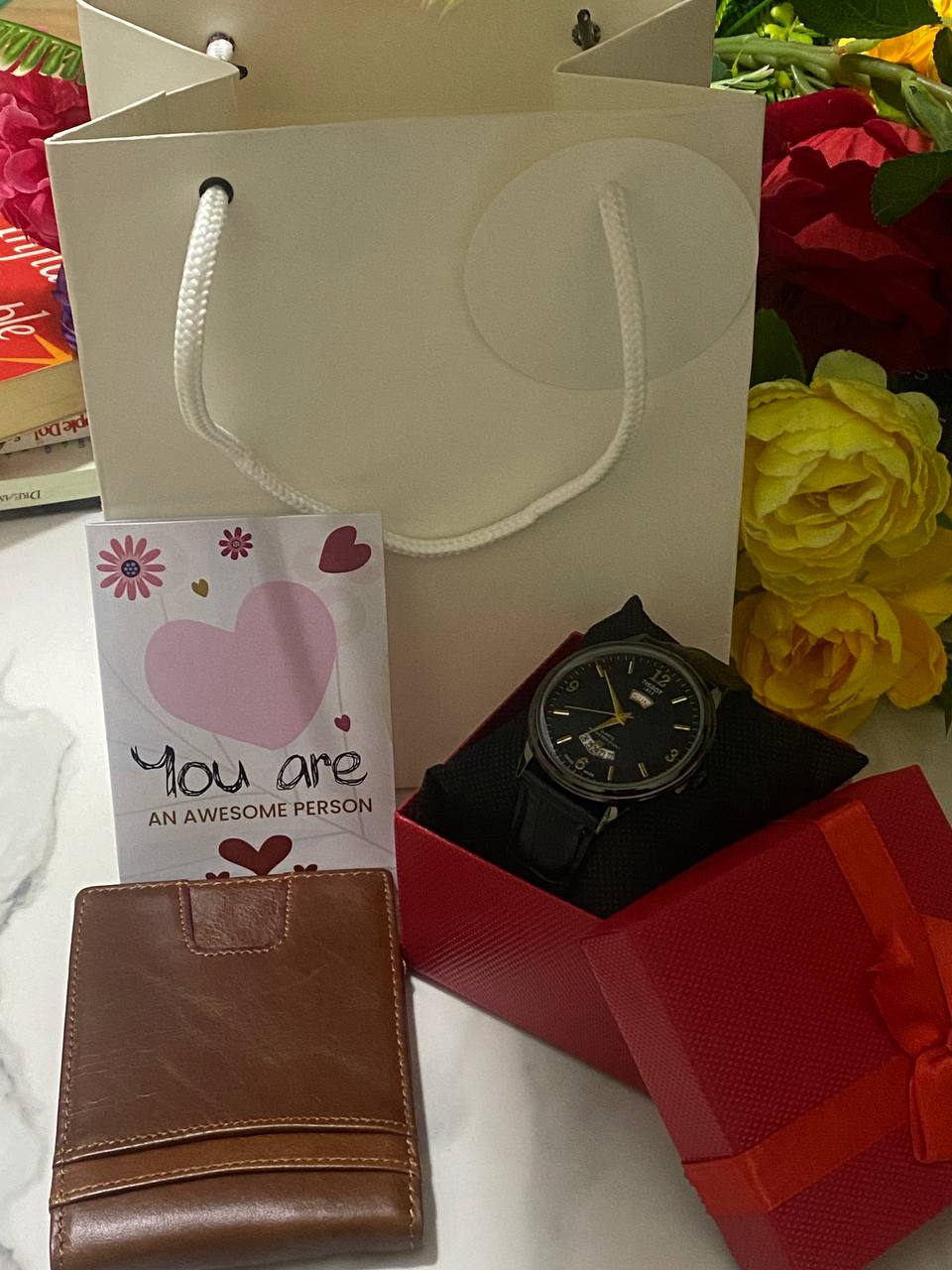 SWISH GENTS WATCH DAY&DATE DISPLAY BATTERY POWERED STAINLESS STEEL WATER RESISTANT TWO-TONE GOLDSILVER ENQUIRIES