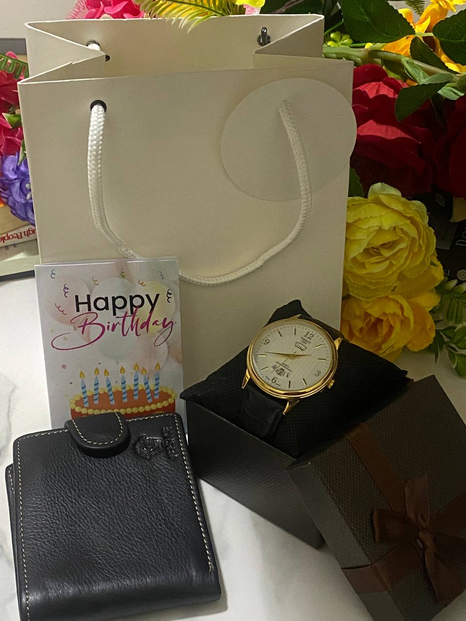 SWISH GENTS WATCH DAY&DATE DISPLAY BATTERY POWERED STAINLESS STEEL WATER RESISTANT TWO-TONE GOLDSILVER ENQUIRIES