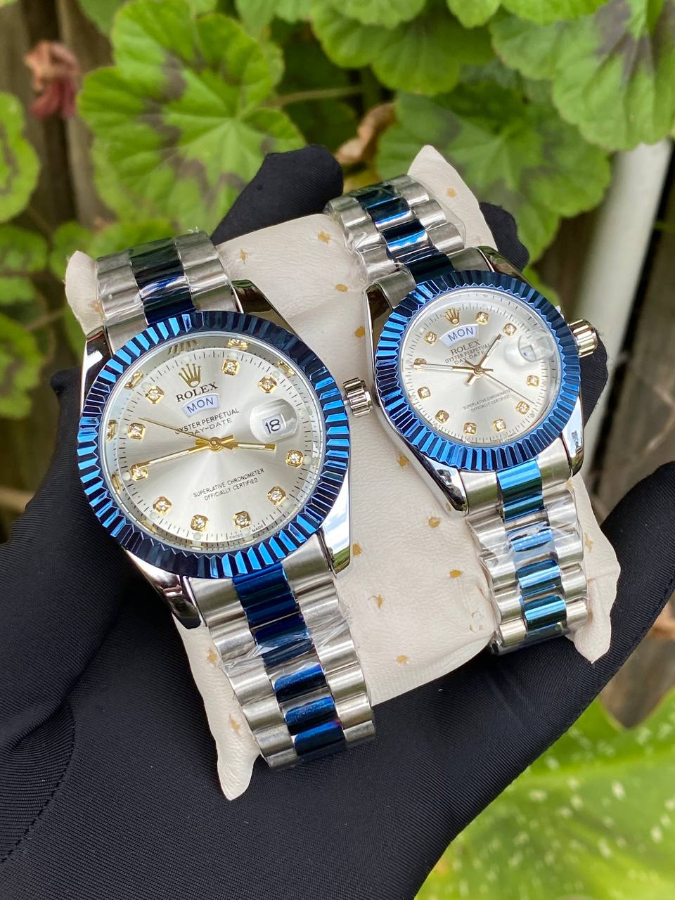 ROLEX COUPLE WATCHES SINGLE PIECE DAY AND DATE DISPLAY WATER RESISTANT BATTERY POWERED ENQUIRIES